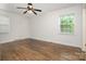 Bright bedroom with hardwood floors and ample natural light from two windows at 5926 Sharon Rd, Charlotte, NC 28210