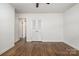 Bedroom featuring hardwood floors and ample closet space with double doors at 5926 Sharon Rd, Charlotte, NC 28210