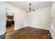 Dining room with modern lighting fixture and open access to the kitchen at 5926 Sharon Rd, Charlotte, NC 28210