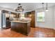 Kitchen with stainless steel appliances, dark wood cabinets, and a center island at 5926 Sharon Rd, Charlotte, NC 28210