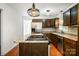 Kitchen island with stainless steel appliances and granite countertops at 5926 Sharon Rd, Charlotte, NC 28210