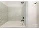 The bathroom features a shower and new white and gray tiles at 5926 Sharon Rd, Charlotte, NC 28210