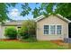 Charming backyard featuring mature landscaping, a well-kept lawn, and a serene outdoor atmosphere at 6007 Edinburgh Ln # 214, Indian Land, SC 29707