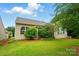 Lush backyard featuring a well-maintained lawn and mature landscaping, offering a serene outdoor space at 6007 Edinburgh Ln # 214, Indian Land, SC 29707