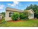 Lush backyard featuring a well-maintained lawn and mature landscaping, creating a private outdoor retreat at 6007 Edinburgh Ln # 214, Indian Land, SC 29707