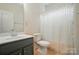 Cozy bathroom showcasing a single vanity, toilet, and a shower with a curtain at 6007 Edinburgh Ln # 214, Indian Land, SC 29707