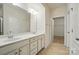 Bathroom with a double sink vanity, mirror and tile flooring at 6007 Edinburgh Ln # 214, Indian Land, SC 29707