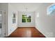 Bright dining room with large windows and hardwood floors is ready for entertaining at 6007 Edinburgh Ln # 214, Indian Land, SC 29707