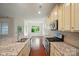 Spacious kitchen with stainless steel appliances, granite countertops, and eat-in dining area at 6007 Edinburgh Ln # 214, Indian Land, SC 29707