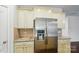 Kitchen features stainless steel refrigerator, granite countertops, and tiled backsplash at 6007 Edinburgh Ln # 214, Indian Land, SC 29707