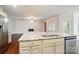Spacious kitchen island boasts a sink, stainless steel dishwasher, and ample storage space at 6007 Edinburgh Ln # 214, Indian Land, SC 29707