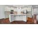 Well-appointed kitchen featuring an island with seating, stainless appliances, granite countertops, and abundant cabinet space at 6007 Edinburgh Ln # 214, Indian Land, SC 29707