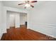 Well lit living room featuring hardwood floors, fireplace, and decorative molding at 6007 Edinburgh Ln # 214, Indian Land, SC 29707
