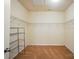 Spacious walk-in closet with metal shelving for maximum storage and organization in neutral decor at 6007 Edinburgh Ln # 214, Indian Land, SC 29707
