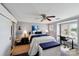 Bright bedroom with desk and water view, featuring a sliding barn door at 635 Portside Dr, Davidson, NC 28036