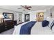 Comfortable bedroom with dark wood furniture and barn door to bathroom at 635 Portside Dr, Davidson, NC 28036