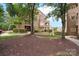Exterior view of the condo building with well maintained landscaping at 635 Portside Dr, Davidson, NC 28036