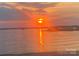 Beautiful sunrise over a serene lake, creating a tranquil and picturesque waterfront setting at 635 Portside Dr, Davidson, NC 28036