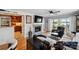 Bright open living room with fireplace, deck access, and view into kitchen at 635 Portside Dr, Davidson, NC 28036