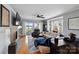 Comfortable living room with a fireplace, lake view, and open layout at 635 Portside Dr, Davidson, NC 28036
