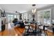 Open living room with hardwood floors, water view, and stylish lighting fixtures at 635 Portside Dr, Davidson, NC 28036
