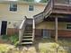Exterior shot featuring a wooden deck with stairs leading to the backyard and the home's exterior at 7021 Willow Bend Ln, Mint Hill, NC 28227