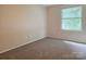 Neutral bedroom with carpet floors, a large window, and ample natural light at 7021 Willow Bend Ln, Mint Hill, NC 28227