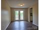 Dining area with luxury vinyl floors and glass doors to the backyard at 7021 Willow Bend Ln, Mint Hill, NC 28227