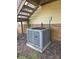 Close-up of the HVAC unit outside, with brick accents and deck stairs in the background at 7021 Willow Bend Ln, Mint Hill, NC 28227