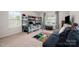 Bright bedroom featuring a bunk bed, Minecraft rug, and window with great light and a seating area at 711 Saddlebred Ln, Locust, NC 28097