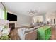 Inviting living room featuring a fireplace, ample seating, wood flooring, and an open layout leading to the dining area at 711 Saddlebred Ln, Locust, NC 28097