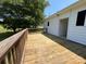 Wooden back deck with an outside view of the house and yard at 8095 New St, Mount Pleasant, NC 28124