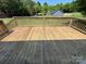 The wooden back deck overlooks the grassy backyard of this property at 8095 New St, Mount Pleasant, NC 28124