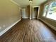 Bedroom featuring wood-look flooring and closet space at 8095 New St, Mount Pleasant, NC 28124