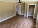 Bedroom featuring wood-look flooring and a large closet at 8095 New St, Mount Pleasant, NC 28124