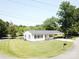 Cozy single-story home with a convenient carport and manicured lawn at 8095 New St, Mount Pleasant, NC 28124