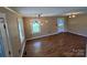Light-filled living room showcases updated lighting and laminate floors at 8095 New St, Mount Pleasant, NC 28124