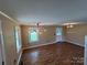 Open living space with updated lighting and laminate flooring at 8095 New St, Mount Pleasant, NC 28124