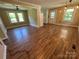 Inviting living room featuring laminate flooring and modern lighting at 8095 New St, Mount Pleasant, NC 28124