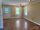 Bright living room features modern lighting fixtures and laminate flooring at 8095 New St, Mount Pleasant, NC 28124