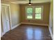 This living room with lots of light has a ceiling fan, closet, and scenic views at 8095 New St, Mount Pleasant, NC 28124