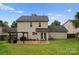 Backyard featuring a patio, seating, and a well-manicured lawn at 8808 Palmutum Pl, Charlotte, NC 28269