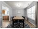 Dining room featuring a modern table and chairs set with view into the kitchen at 8808 Palmutum Pl, Charlotte, NC 28269