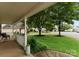 View from the cozy front porch showcasing the well-manicured lawn and neighborhood street at 8808 Palmutum Pl, Charlotte, NC 28269