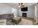 Comfortable living room featuring a fireplace and plush seating at 8808 Palmutum Pl, Charlotte, NC 28269