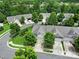 Aerial view of well-maintained homes in a desirable community with mature trees and landscaping at 9020 Smokey Hill Ln, Fort Mill, SC 29707