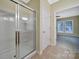 This bathroom features tile floors, walk-in shower with glass door, and neutral paint at 9020 Smokey Hill Ln, Fort Mill, SC 29707