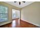 Cozy room with hardwood floors, neutral paint, shutters, and lots of natural light at 9020 Smokey Hill Ln, Fort Mill, SC 29707