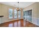 Bright dining area with chandelier, hardwood flooring, and sliding doors leading to the backyard at 9020 Smokey Hill Ln, Fort Mill, SC 29707