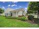 Charming home featuring manicured landscaping, mulch beds, and green grass at 9020 Smokey Hill Ln, Fort Mill, SC 29707